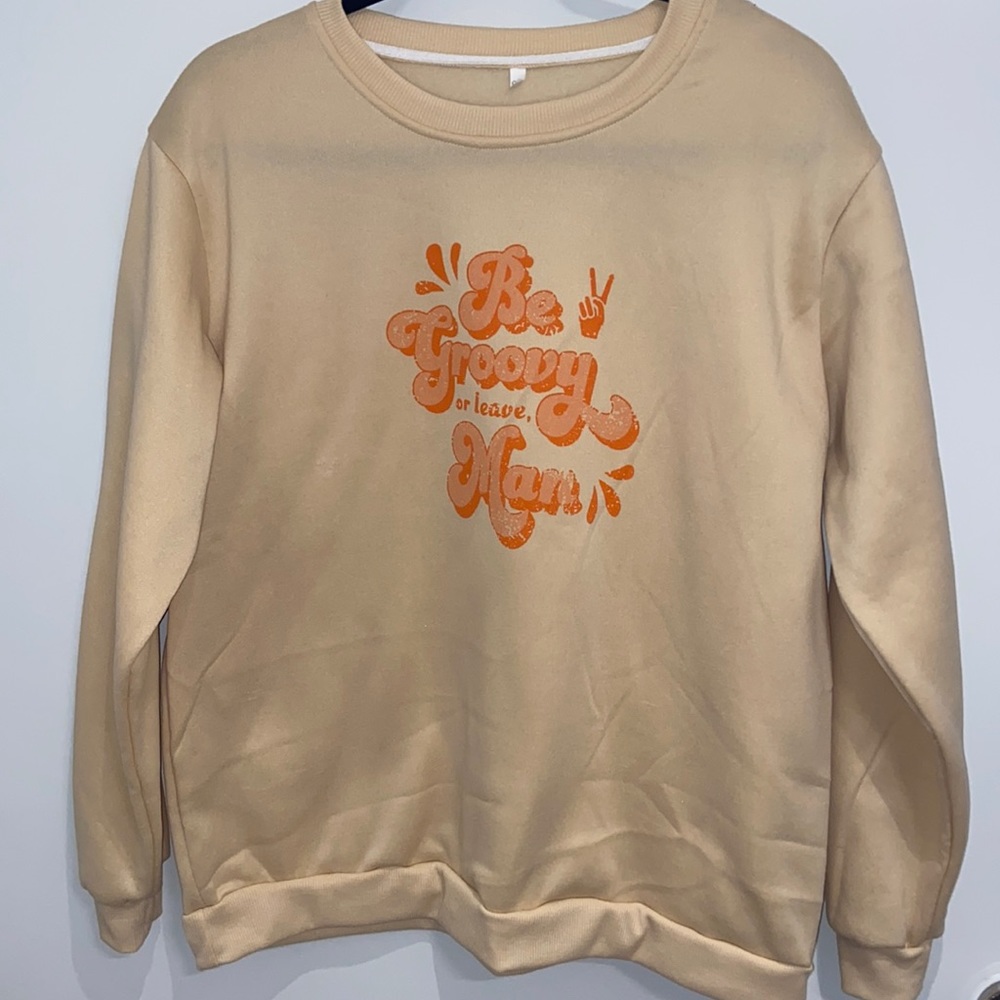 Graphic sweatshirt “Be Groovy or leave, Man”